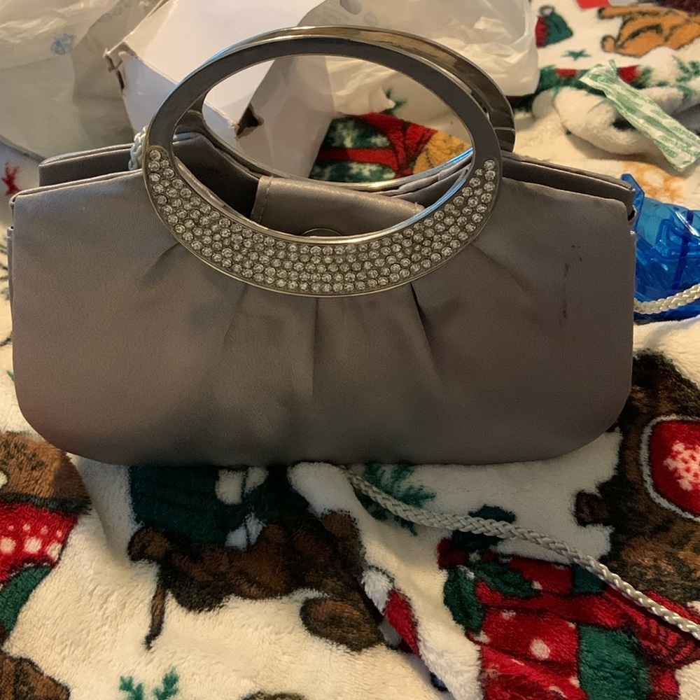 Grey purse with diamonds on it